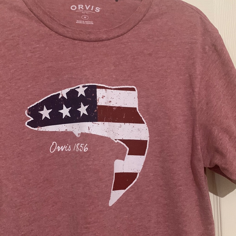 Orvis brand patriotic fish T shirt. Pink  with red white and blue fish graphic
